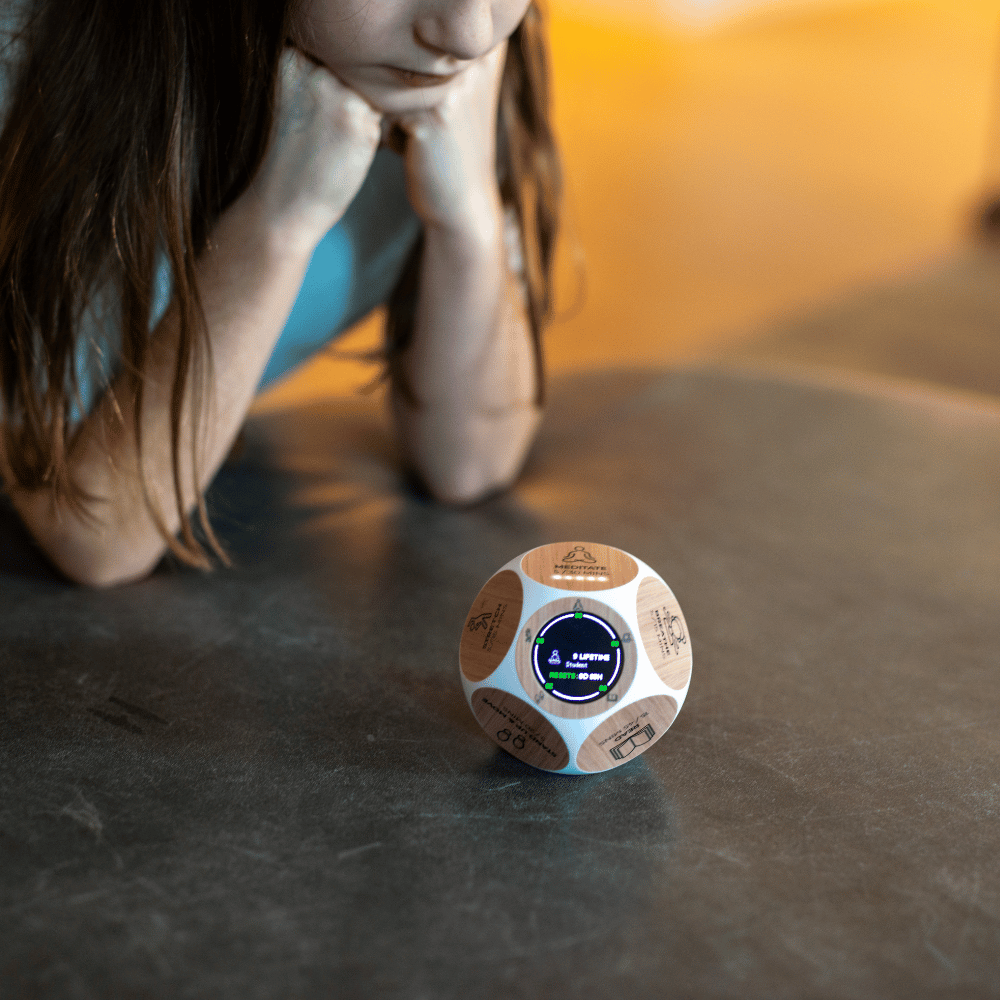 A little girl using the Mindsight habit tracker to meditate