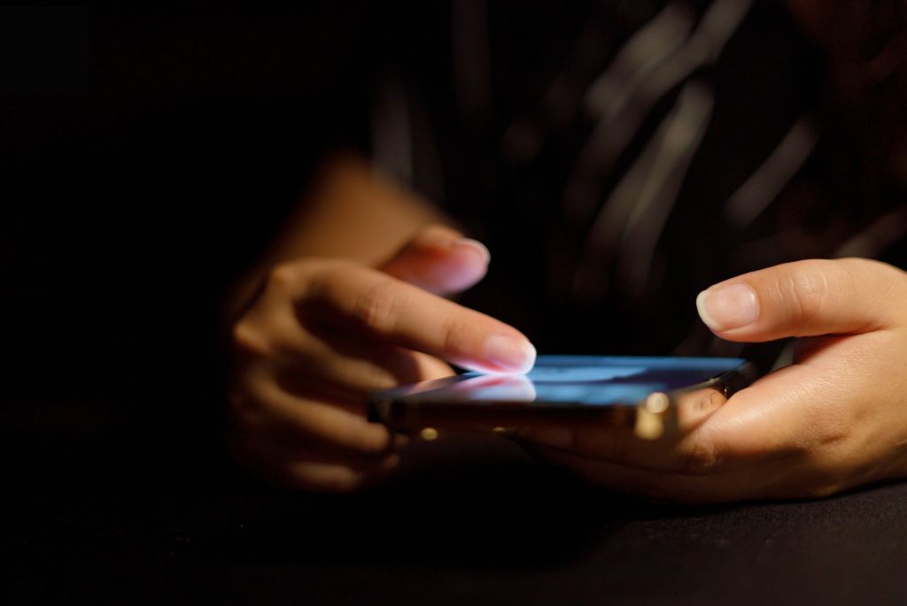 Guy doom scrolling on his phone