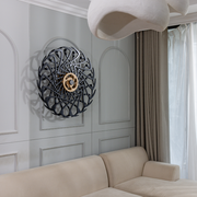 Kinetic wall art above couch in living room