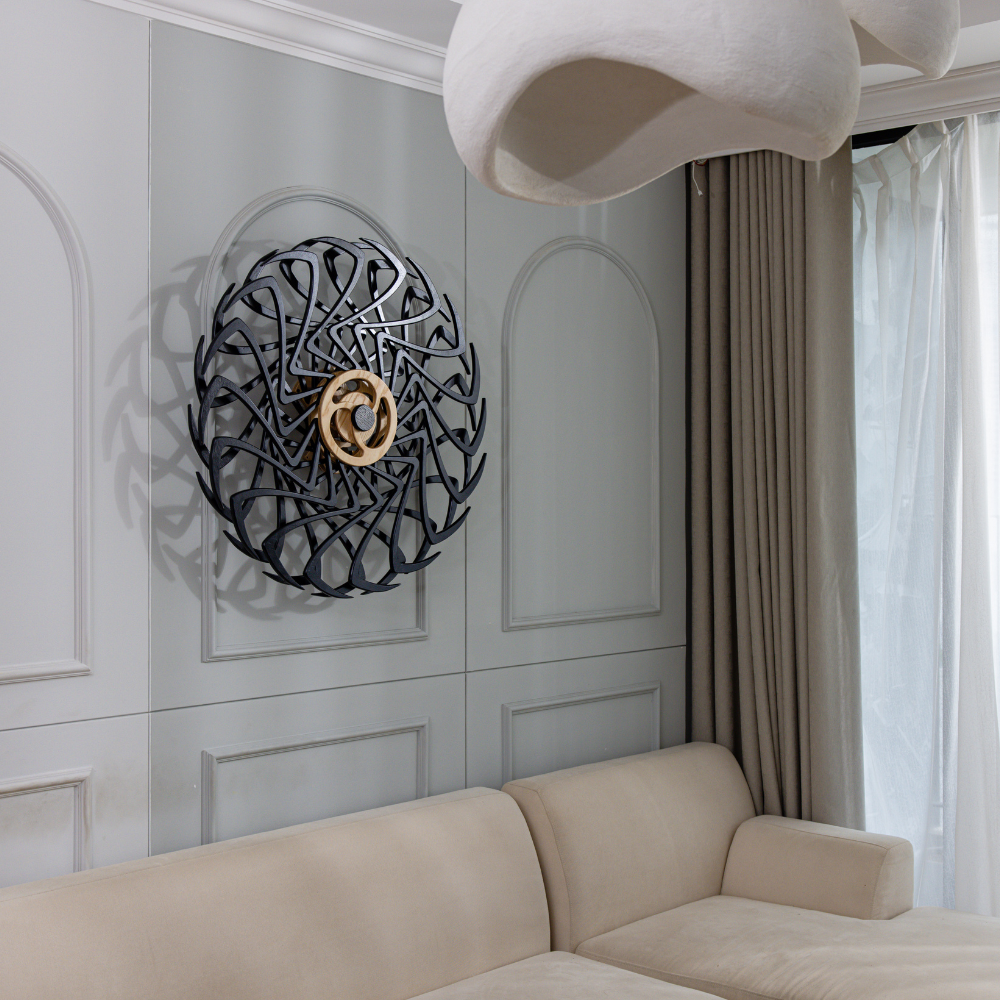 Kinetic wall art above couch in living room
