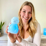 Woman showing her breathing buddha to the camera