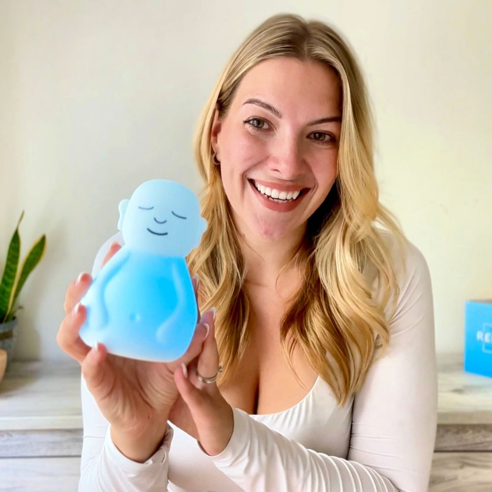 Woman showing her breathing buddha to the camera