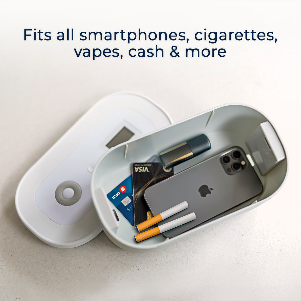 Mindsight lockbox open with phone, cigarettes, vape, and credit cards inside, showing storage capacity for small essentials