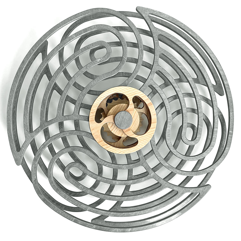 Circular kinetic wall decor with intricate gray swirl design and a wooden center mechanism.