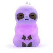 Slow It Down Sloth glowing purple, featuring a smiling sloth design made of soft silicone for mindfulness and relaxation.