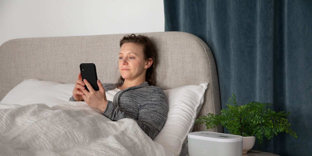 Women on her phone before bed
