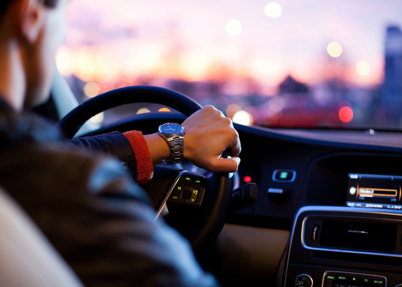 A driver with both hands on the wheel