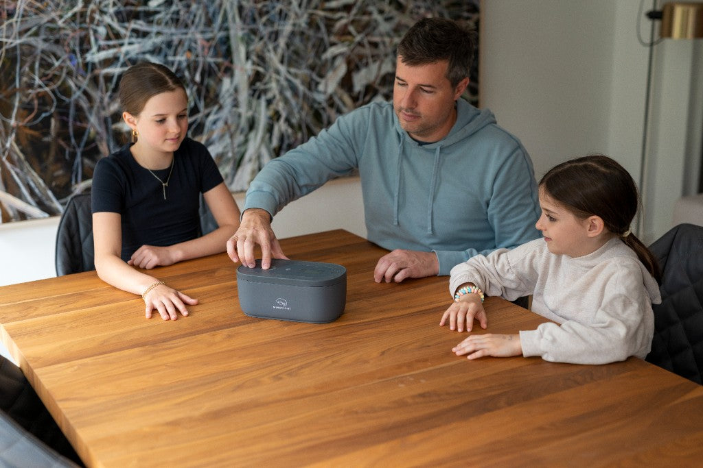 A parent setting the lock box at the table