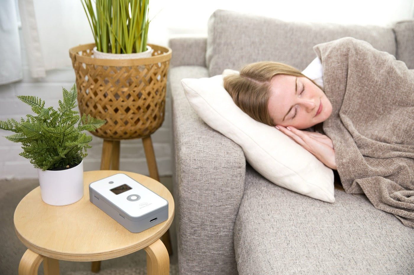 A Phone Lock Box on a side table, with a charging port on the side